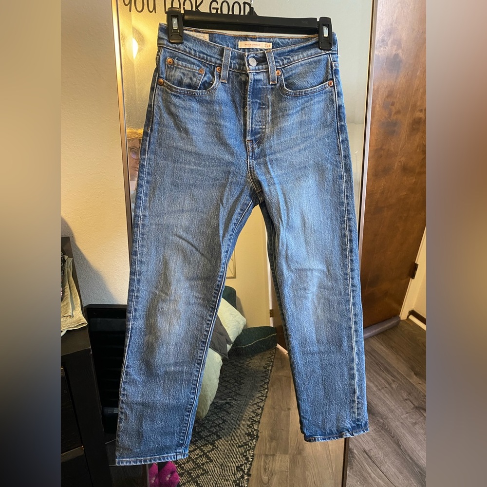 Woman’s Levis Wedgie Straight jeans in size 24 with multi button fly closure